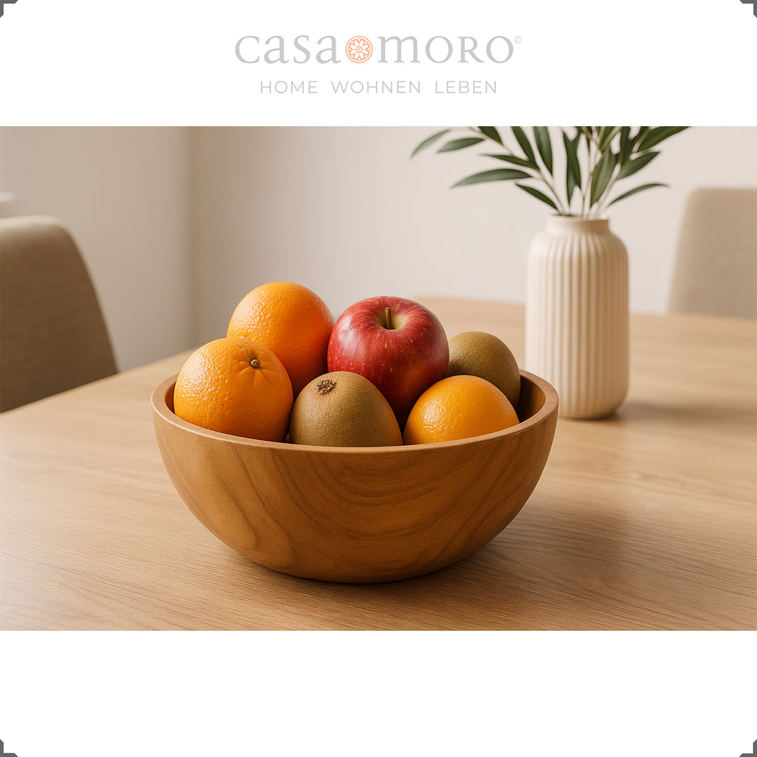 Holzschale mit Obst auf Tisch, ideal als Tischdeko